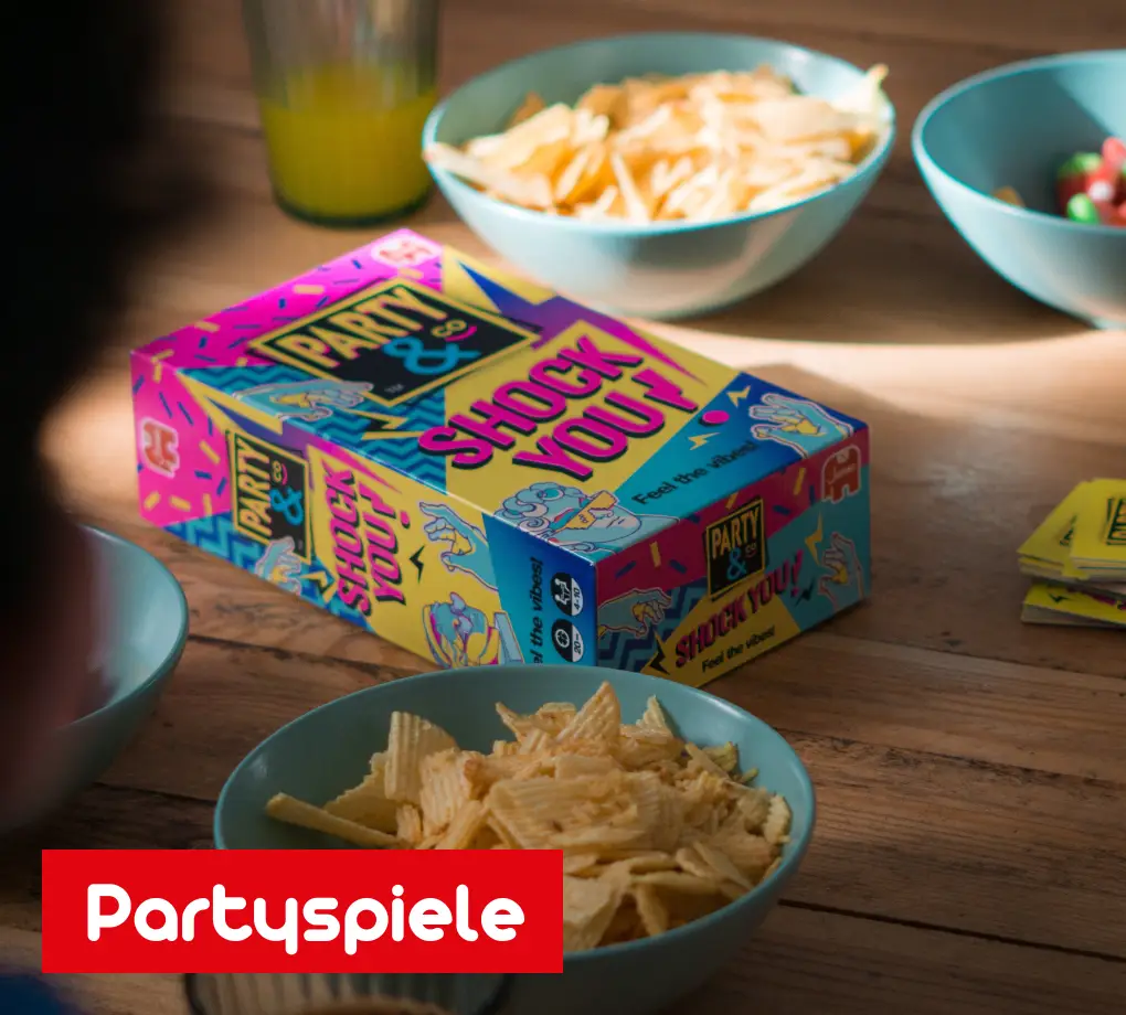 Partyspiel Party & Co. – Shock You liegt auf einem Tisch